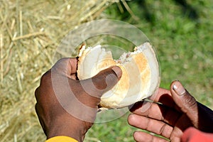 African hands sharing daily bread