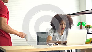 African and Hispanic couple supporting each other at freelance work at home