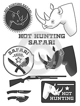 African hunter safari labels, rhinoceros emblems and design elements.