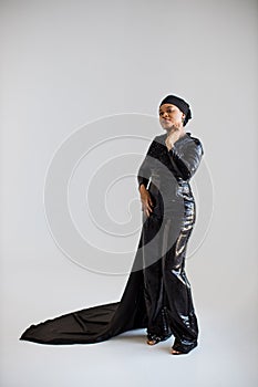 African islamic woman in black evening wear posing indoors