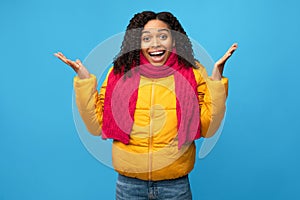 African Lady Looking At Camera In Surprise Over Blue Background