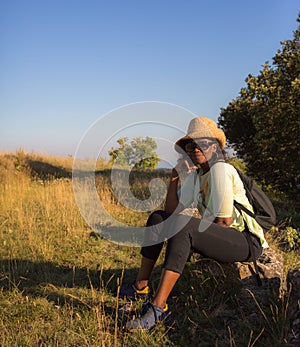 African Lady resting during an excursion