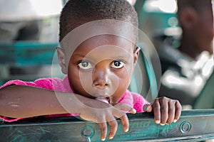 African little child portrait big eyes looking on camera