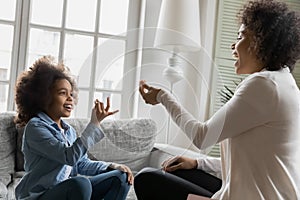 African little daughter using sign language communicates with mother