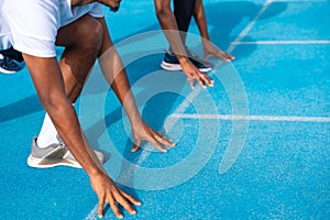 African male hands in position to start a race