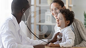 African male pediatrician hold stethoscope exam child boy patient