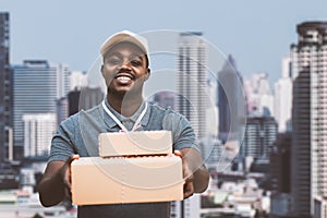 African male postal delivery courier man holding delivering package boxs.Concept of modern urban parcel delivery system