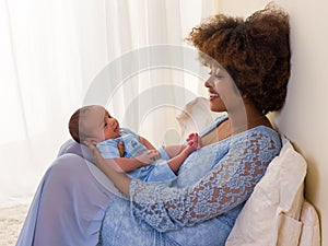 African Mama with baby in blue dress