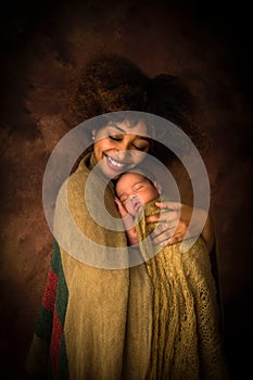 African Mama holding newborn baby