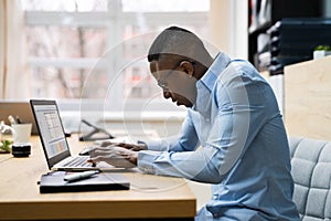 African Man Bad Posture Working Typing