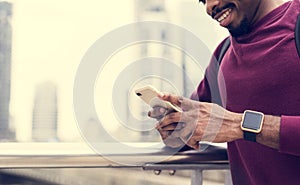 African man in city using mobile phone