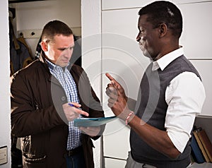 African man does not agreeing with claims of landlord