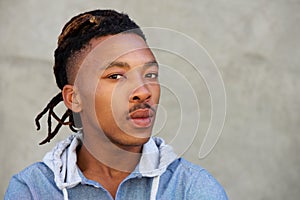 African man with dreadlocks looking at camera