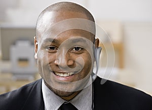 African man with hands-free cell phone device