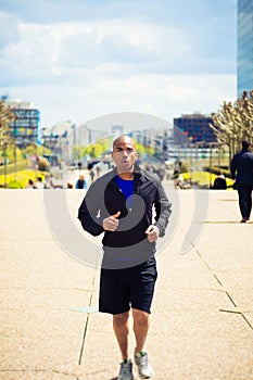 African Man Jogging In La Defense, Paris