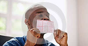 African Man Kissing Gamble Ticket