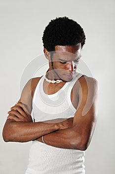 African man looking his arm muscles