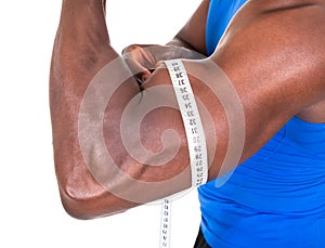 African Man Measuring His Biceps