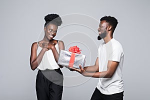 African man offering gift to woman isolated on white background