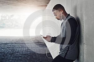 African man, phone and earphones with text, start and workout for training and health. Athlete, music and cellphone for