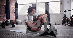 African man, phone and happy in gym with texting for notification, chat or web blog for training. Person, smartphone and