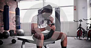 African man, phone and smile in gym for texting with meme, chat and web with sweat at training. Person, smartphone and