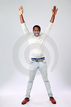 African man with raised hands