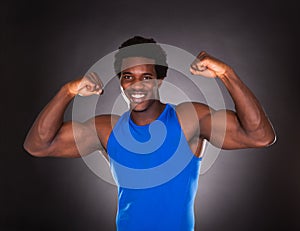 African Man Showing Muscle