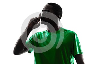 African man soccer player hushing silhouette