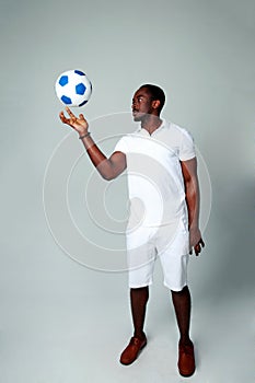 African man spinning a ball on his finger