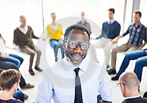 African Man Standing in Front of a Support Group