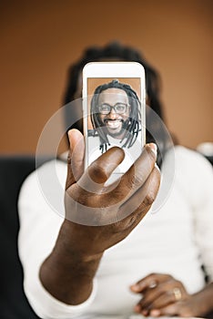African man taking a selfie.