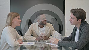 African Man Talking During Meeting with Colleagues