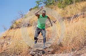 African man Trail running in Meadow on mountain outdoor. sport adventure . black man runner  jumping on country path or cross-