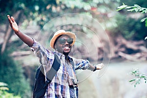 African man traveler smile and relax in jungle.Survival travel concept