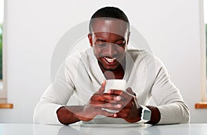 African man using smartphone