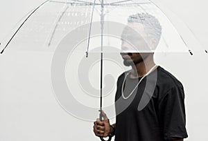 African man using an umbrella