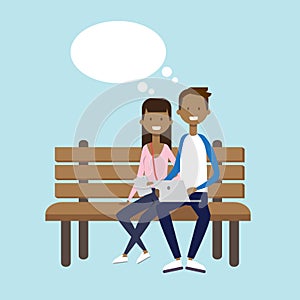 African man woman using laptop sitting wooden bench couple chat bubble character full length over blue background flat