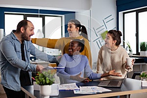 African manager businesswoman and diverse team celebrating victory