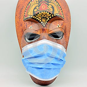 African mask with a surgical mask photo