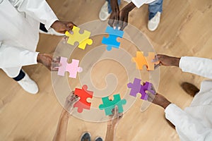 African Medical Doctors Holding Puzzle Together