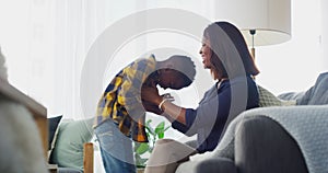 African mother, boy and tickling by sofa with smile, bonding and care with funny chat in home living room. Mom, child