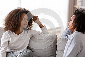 African mother and daughter chatting spending free time at home