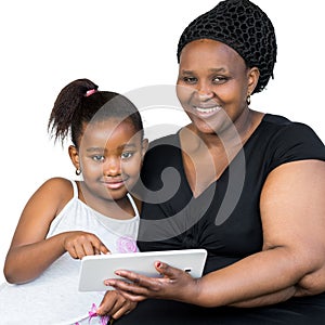 African mother with little daughter holding tablet.