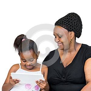 African mother and little daughter looking at tablet together.