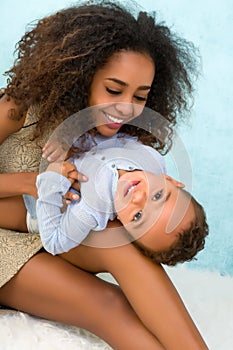 African mother and son playing