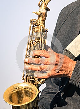 African musician hand playing music with trumpet