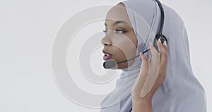 African Muslim customer representative business woman with headset helping and supporting online with customer