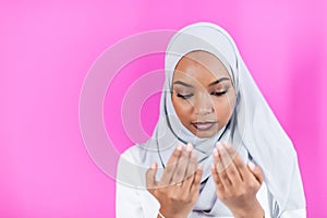African Muslim woman makes traditional prayer to God