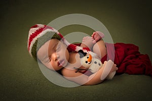 African newborn baby with christmas snowman